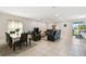 Open-concept living space with a comfortable seating area, dining table, and bright natural light at 1816 Forest Glen Dr, Fruitland Park, FL 34731