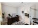 Well-lit office features a dark wood desk, chair, and a view into the home's living spaces at 1816 Forest Glen Dr, Fruitland Park, FL 34731