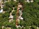 Aerial view shows property lines and the residence surrounded by tall trees at 18240 Lynbrook Rd, Orlando, FL 32820