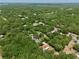 An aerial view showing a single Gathering home in a wooded neighborhood at 18240 Lynbrook Rd, Orlando, FL 32820