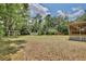 Lush, well-maintained backyard offering a serene outdoor space, surrounded by trees at 18240 Lynbrook Rd, Orlando, FL 32820