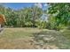 Lush, well-maintained backyard offering a serene outdoor space, surrounded by trees at 18240 Lynbrook Rd, Orlando, FL 32820