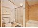 This bathroom has a combination bathtub and shower with tiled walls, plus a matching tiled shower stall at 18240 Lynbrook Rd, Orlando, FL 32820