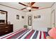 The bedroom features modern ceiling fan, wood-look laminate flooring and a modern bedroom set at 18240 Lynbrook Rd, Orlando, FL 32820
