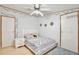 This bedroom features a ceiling fan, and light hardwood floors at 18240 Lynbrook Rd, Orlando, FL 32820