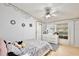 This bedroom features a ceiling fan and natural light from a window at 18240 Lynbrook Rd, Orlando, FL 32820
