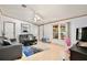 Bright living room with neutral decor, laminate floors, and a ceiling fan at 18240 Lynbrook Rd, Orlando, FL 32820