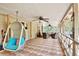 The screened patio offers lounge seating, as well as a hanging chair with room to enjoy the outdoors at 18240 Lynbrook Rd, Orlando, FL 32820