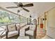 The spacious, enclosed patio has plenty of seating to enjoy the surrounding nature at 18240 Lynbrook Rd, Orlando, FL 32820
