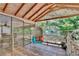 Relaxing screened porch with stylish hanging chair and outdoor seating at 18240 Lynbrook Rd, Orlando, FL 32820