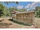 Cozy screened-in porch furnished with comfortable seating and lattice detailing at 18240 Lynbrook Rd, Orlando, FL 32820