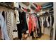 Walk-in closet with extensive shelving and rod system perfect for storage at 18240 Lynbrook Rd, Orlando, FL 32820