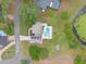Expansive aerial view of property showcasing a beautiful pool, well-kept lawn, and charming shed at 1901 Lakeshore Cir, Longwood, FL 32750