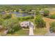 A gorgeous view of a property with lush greenery, a serene lake, and clearly defined boundaries at 1901 Lakeshore Cir, Longwood, FL 32750