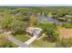 A gorgeous home with a rooftop deck overlooking lush greenery and a serene lake at 1901 Lakeshore Cir, Longwood, FL 32750