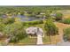A gorgeous view of a property with lush greenery, a serene lake, and clearly defined boundaries at 1901 Lakeshore Cir, Longwood, FL 32750
