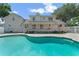 Expansive backyard featuring a beautiful pool, a spacious patio, and a well-maintained lawn for outdoor enjoyment at 1901 Lakeshore Cir, Longwood, FL 32750