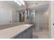 Updated bathroom featuring granite countertops, vanity with storage, and a glass shower at 1901 Lakeshore Cir, Longwood, FL 32750