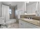 Cozy bathroom featuring granite countertops, vanity with storage, and a shower at 1901 Lakeshore Cir, Longwood, FL 32750