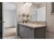 Bathroom with granite countertops, vanity with storage, and neutral tile flooring at 1901 Lakeshore Cir, Longwood, FL 32750