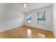 Cozy bedroom with hardwood floors, natural light and simple ceiling light fixture at 1901 Lakeshore Cir, Longwood, FL 32750