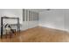 Spacious bedroom featuring hardwood floors, built in wall storage, and bright natural light at 1901 Lakeshore Cir, Longwood, FL 32750