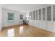 Bright bedroom with hardwood floors, large windows, and built-in storage at 1901 Lakeshore Cir, Longwood, FL 32750