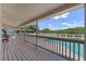 Relaxing view from the covered deck, showcasing the backyard and inviting pool area on a sunny day at 1901 Lakeshore Cir, Longwood, FL 32750