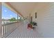 Spacious covered deck providing an ideal spot for outdoor relaxation and overlooking the backyard and pool area at 1901 Lakeshore Cir, Longwood, FL 32750