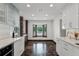 Bright dining area with modern cabinets and countertops adjacent to a large bay window at 1901 Lakeshore Cir, Longwood, FL 32750