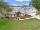 Beautiful two-story home featuring solar panels and a well-manicured front yard at 1901 Lakeshore Cir, Longwood, FL 32750