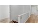 Hallway featuring hardwood floors and white trim at 1901 Lakeshore Cir, Longwood, FL 32750