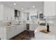 Contemporary kitchen featuring sleek cabinetry, marble countertops, and stainless steel appliances at 1901 Lakeshore Cir, Longwood, FL 32750