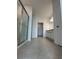 Bright bathroom with granite counters, walk-in shower, and walk-in closet at 2082 Gold Dust Dr, Clermont, FL 34715