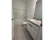 Bathroom featuring a shower-tub combo, toilet, and sink with modern fixtures at 2082 Gold Dust Dr, Clermont, FL 34715