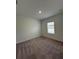 Bedroom with carpet and a window at 2082 Gold Dust Dr, Clermont, FL 34715