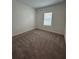 Bedroom with carpet and a window at 2082 Gold Dust Dr, Clermont, FL 34715