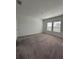 This bedroom features carpeted floors and two windows at 2082 Gold Dust Dr, Clermont, FL 34715