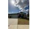 Charming single-story home featuring a two-car garage and stone pillar accents at 2082 Gold Dust Dr, Clermont, FL 34715