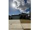Charming single-story home featuring a two-car garage and stone pillar accents at 2082 Gold Dust Dr, Clermont, FL 34715