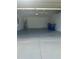 Spacious two-car garage featuring epoxy flooring and ample lighting at 2082 Gold Dust Dr, Clermont, FL 34715