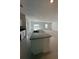 Bright, modern kitchen island featuring a granite countertop and ample counter space at 2082 Gold Dust Dr, Clermont, FL 34715
