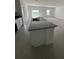 Bright, modern kitchen island featuring a granite countertop and ample counter space at 2082 Gold Dust Dr, Clermont, FL 34715