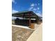 Community mailboxes under a covered pavilion with convenient trash receptacles nearby at 2082 Gold Dust Dr, Clermont, FL 34715