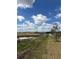 Scenic view from the property showcasing the landscape under a bright, cloudy sky at 2082 Gold Dust Dr, Clermont, FL 34715