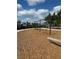 Community playground featuring swings, natural wood elements, and a soft, safe ground cover at 2082 Gold Dust Dr, Clermont, FL 34715