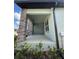 Open porch with stone pillar and view of the front yard at 2082 Gold Dust Dr, Clermont, FL 34715