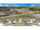 Stunning aerial view of a community surrounded by lush greenery and serene lakes under a blue sky at 2170 Derwent Dr, Davenport, FL 33896