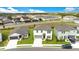 Aerial view of a two-story home with green grass at 2170 Derwent Dr, Davenport, FL 33896