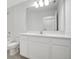 Bathroom vanity with mirror and sink with white cabinets and tile floors at 2170 Derwent Dr, Davenport, FL 33896